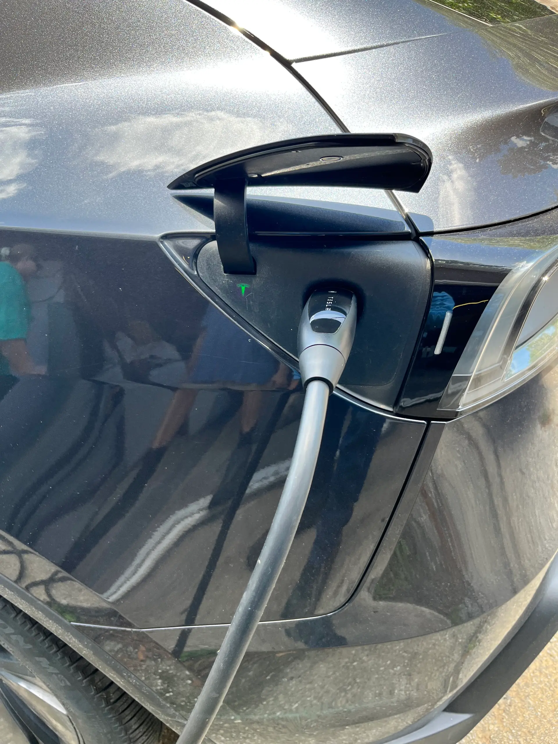 Tesla EV charger installed on a Houston home wall by Electric Yahweh